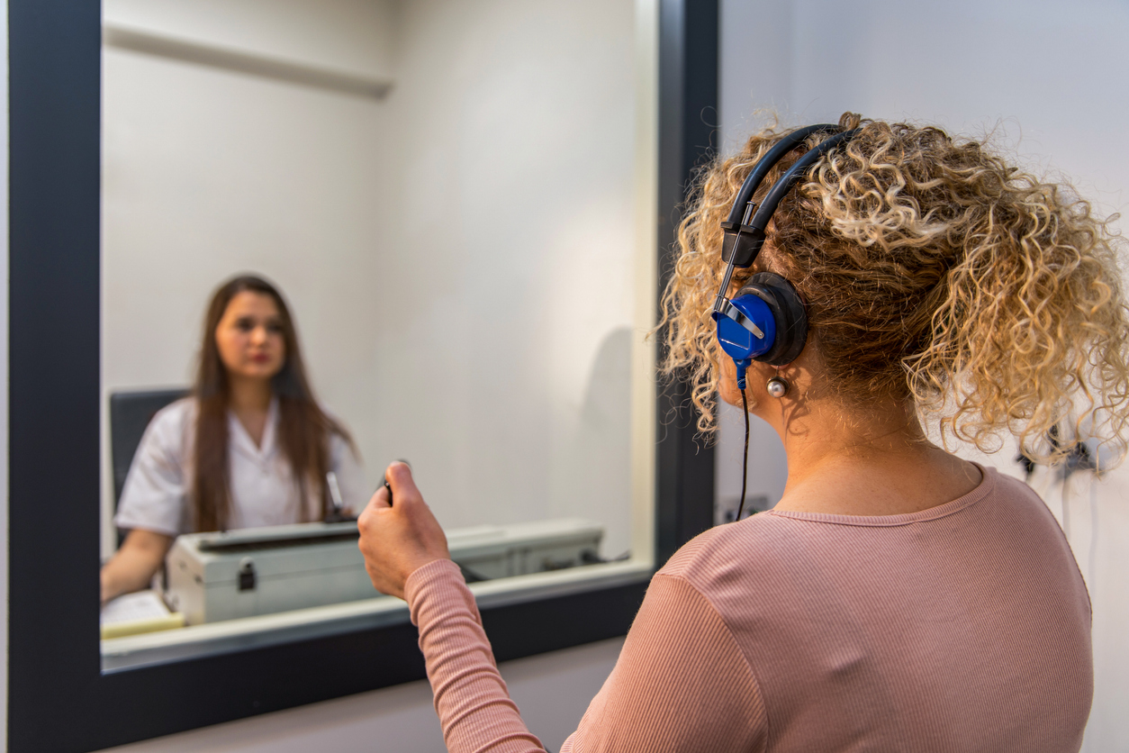 Woman taking a hearing test.